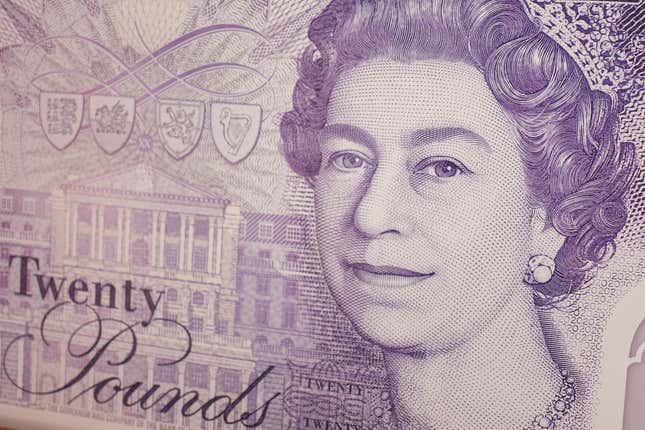 A close-up photo of an English 20-pound banknote printed in light purple ink. 