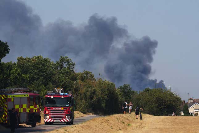 Emergency services in attendance following fire on Dartford Heath on July 19, 2022 in Dartford, England. A series of grass fires broke out around the British capital amid an intense heatwave.