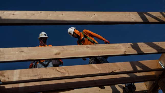 Construction workers are seen on a construction site roof during a heat wave where temperatures rise over 110 degrees Fahrenheit for 27 consecutive days, in Scottsdale, at the Phoenix metro area, Arizona, U.S., July 28, 2023. 